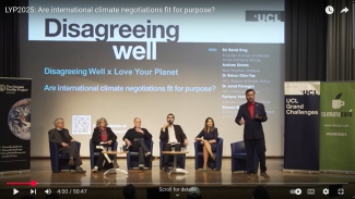 Panel of speakers on stage at UCL event